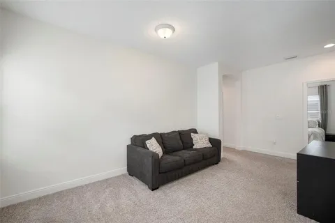 a bedroom with a bed and ceiling fan