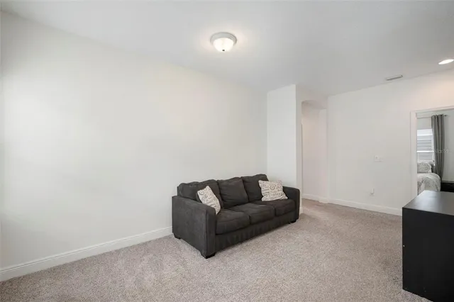 a bedroom with a bed and ceiling fan