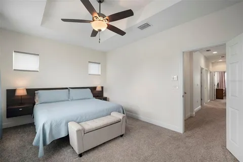 a bedroom with a bed and cabinets