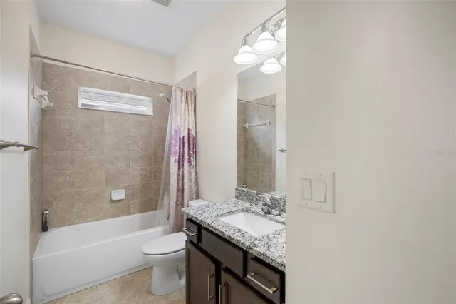 a view of a swimming pool with outdoor seating