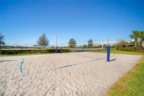 a view of a swimming pool with a yard