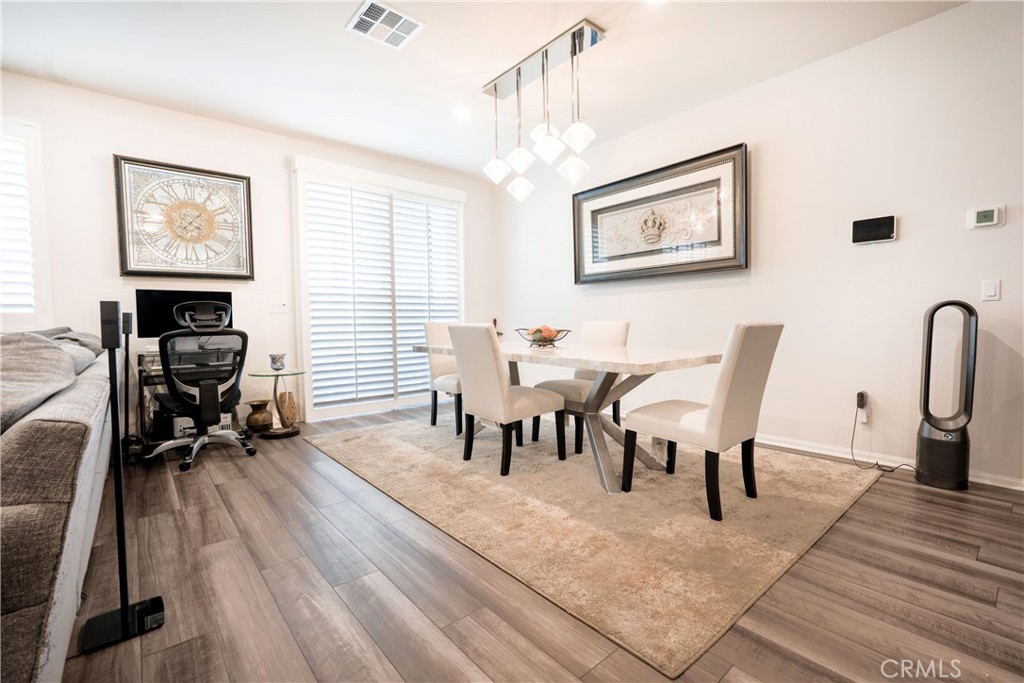 15630 Raptor Road Moreno Valley, CA 92551 - Photo 11 of 25 a view of a livingroom with furniture and a window
