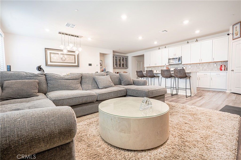 15630 Raptor Road Moreno Valley, CA 92551 - Photo 12 of 25 a living room with furniture and a large window