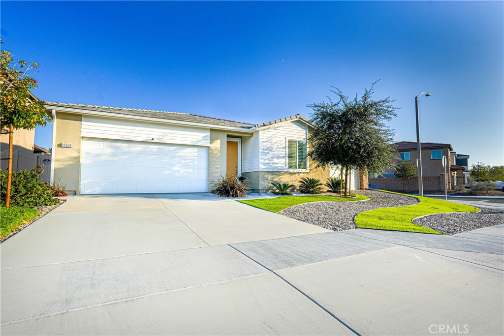 15630 Raptor Road Moreno Valley, CA 92551 - Photo 2 of 25 a view of yellow house with swimming pool in front of it