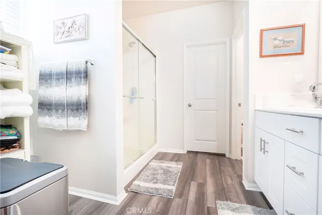 a white toilet sitting next to a bathroom sink