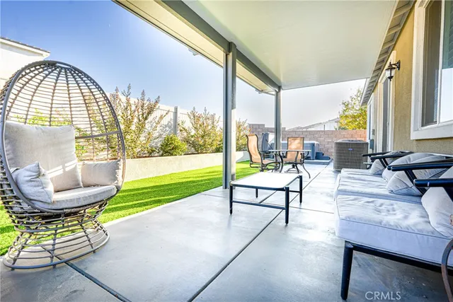 a view of chairs and table in balcony