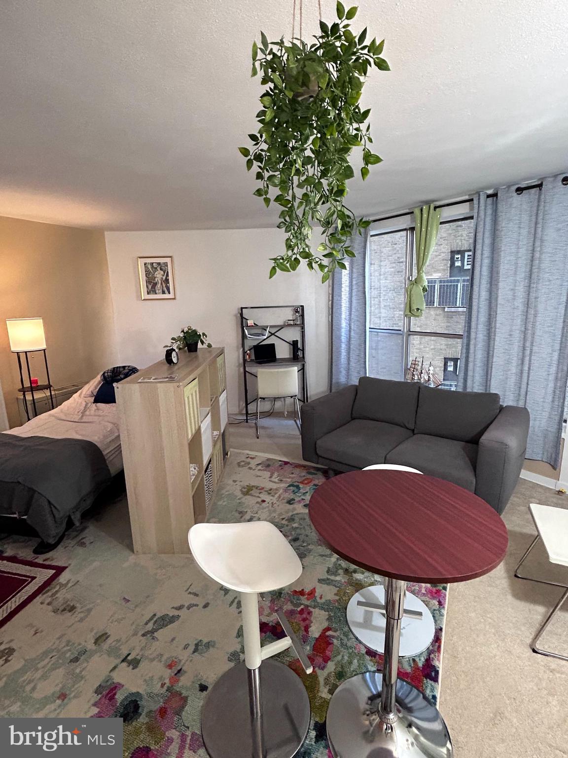 224 West Rittenhouse Square, Unit 1702 Philadelphia, PA 19103 - Photo 2 of 16 a living room with furniture a table and a potted plant