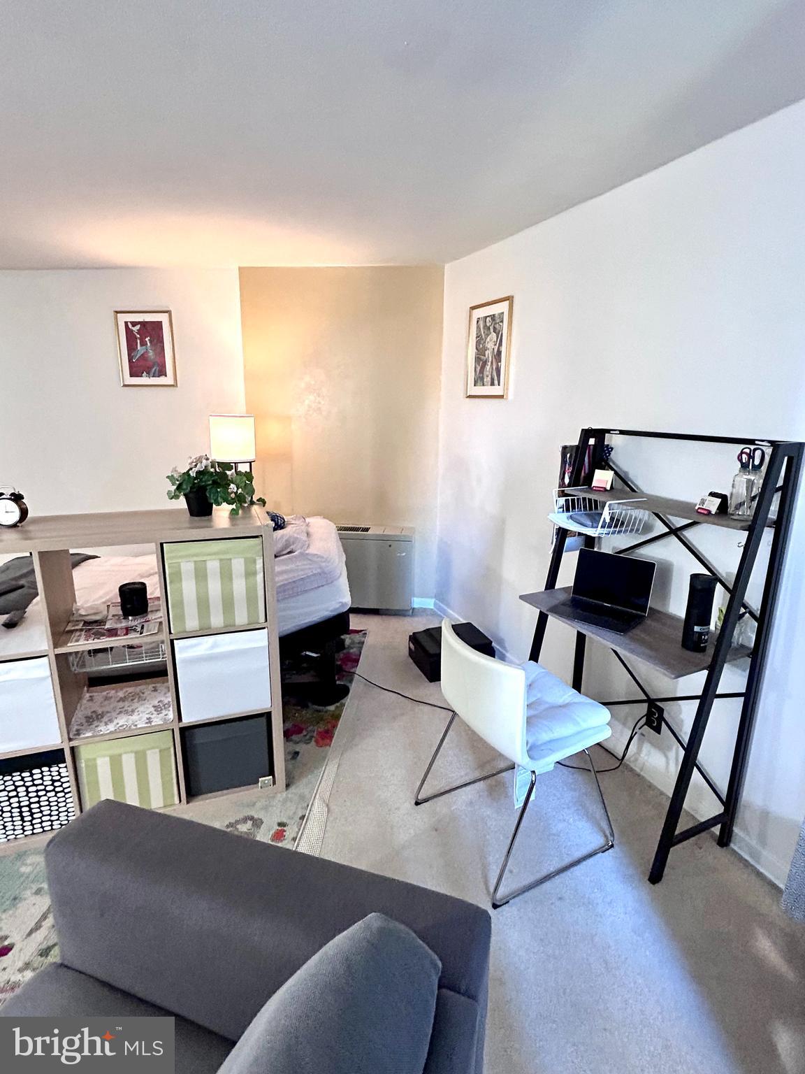 224 West Rittenhouse Square, Unit 1702 Philadelphia, PA 19103 - Photo 6 of 16 a living room with furniture and a wooden floor