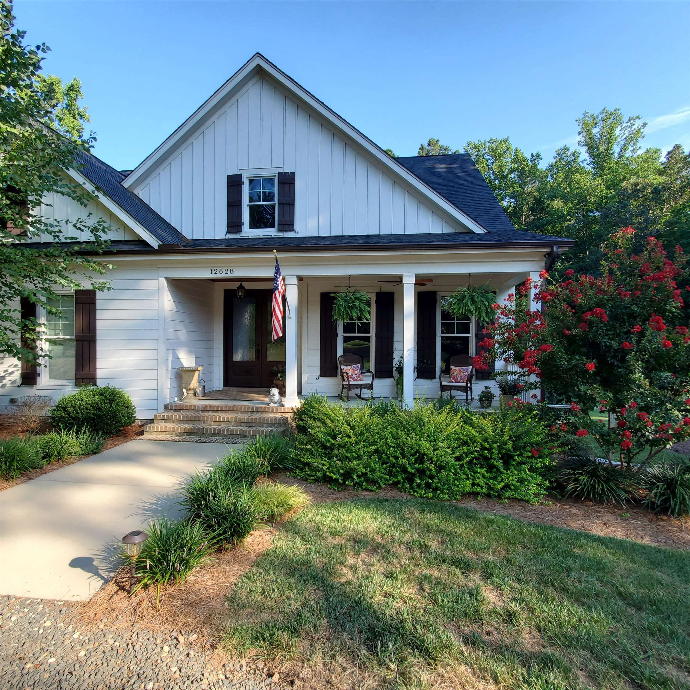 12628 Old Creedmoor Road Raleigh, NC 27613 - Photo 1 of 32 a view of a yard in front of house