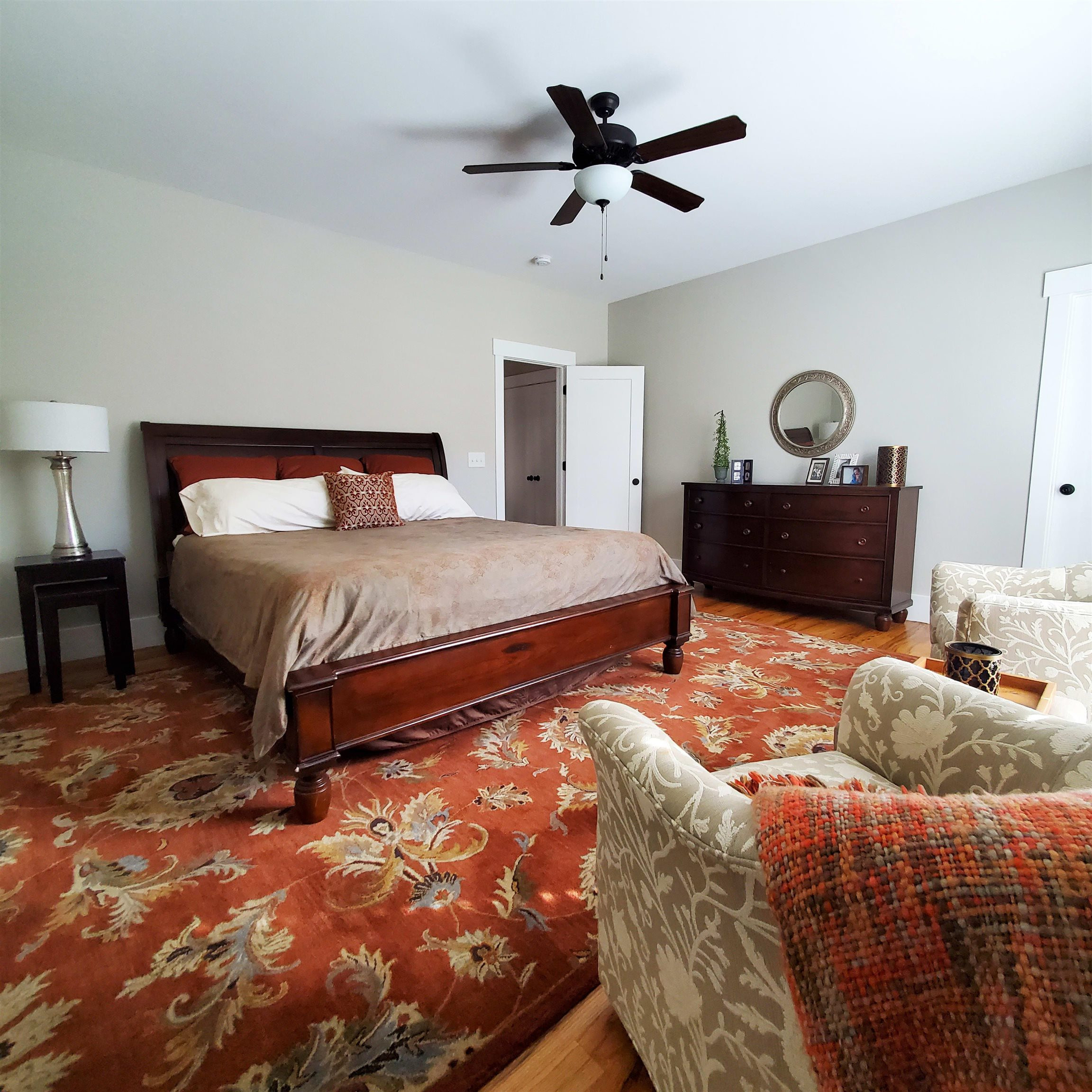 12628 Old Creedmoor Road Raleigh, NC 27613 - Photo 18 of 32 a bedroom with a bed window and a ceiling fan