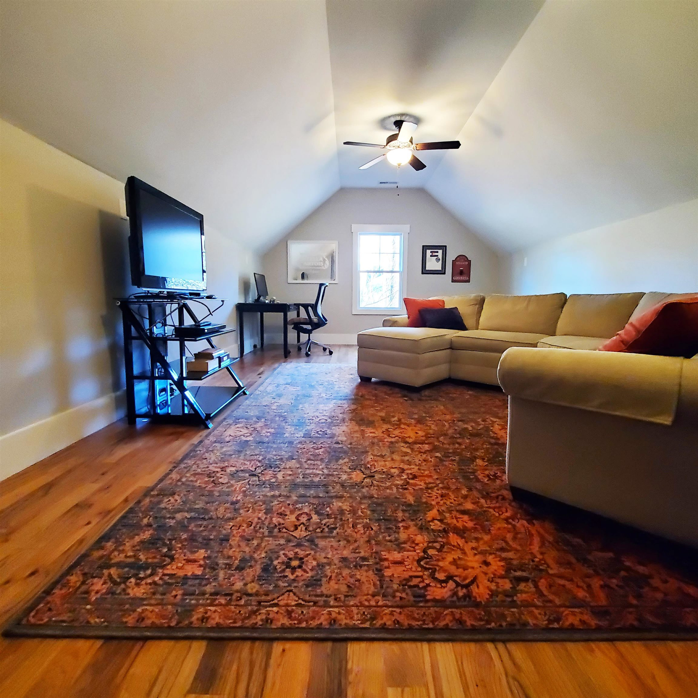 12628 Old Creedmoor Road Raleigh, NC 27613 - Photo 20 of 32 a living room with furniture and a wooden floor