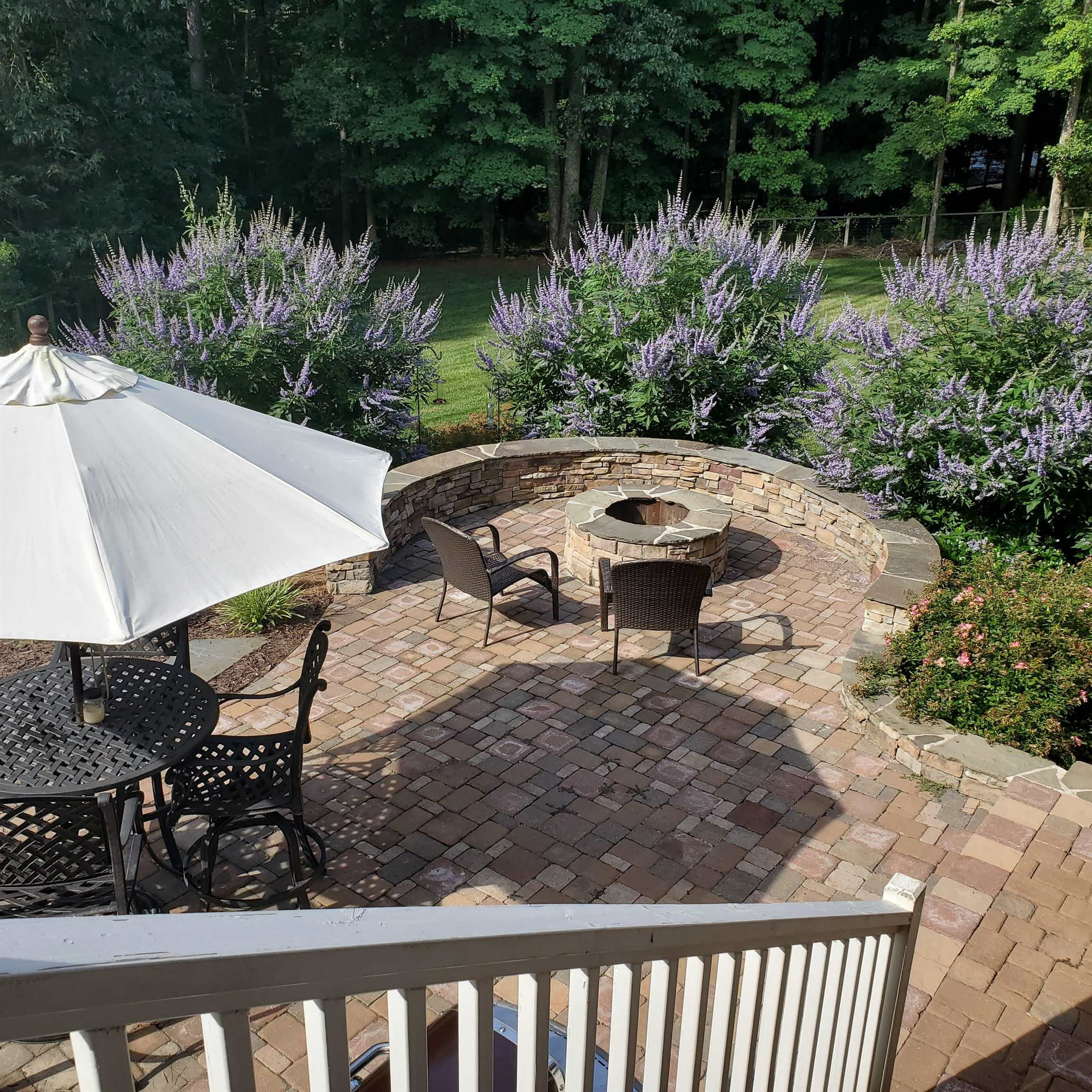 12628 Old Creedmoor Road Raleigh, NC 27613 - Photo 22 of 32 a view of a backyard with sitting area
