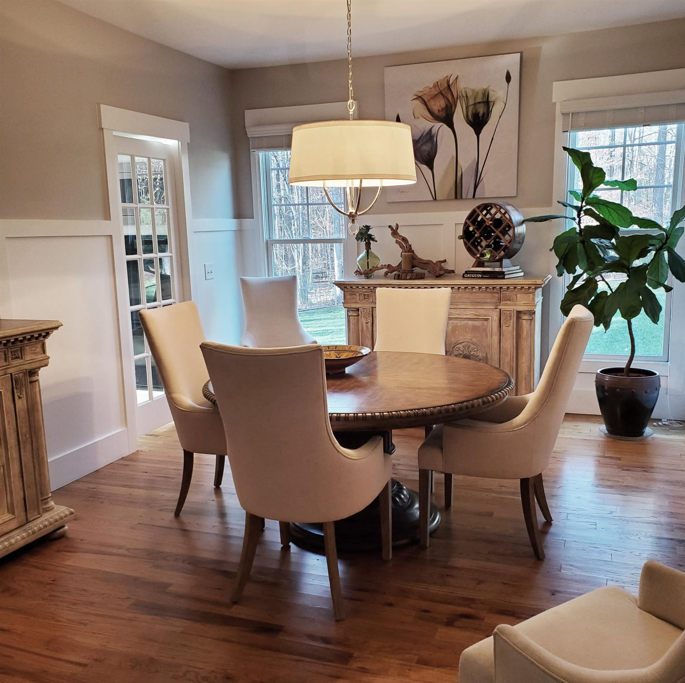 12628 Old Creedmoor Road Raleigh, NC 27613 - Photo 7 of 32 a view of a dining room with furniture and wooden floor