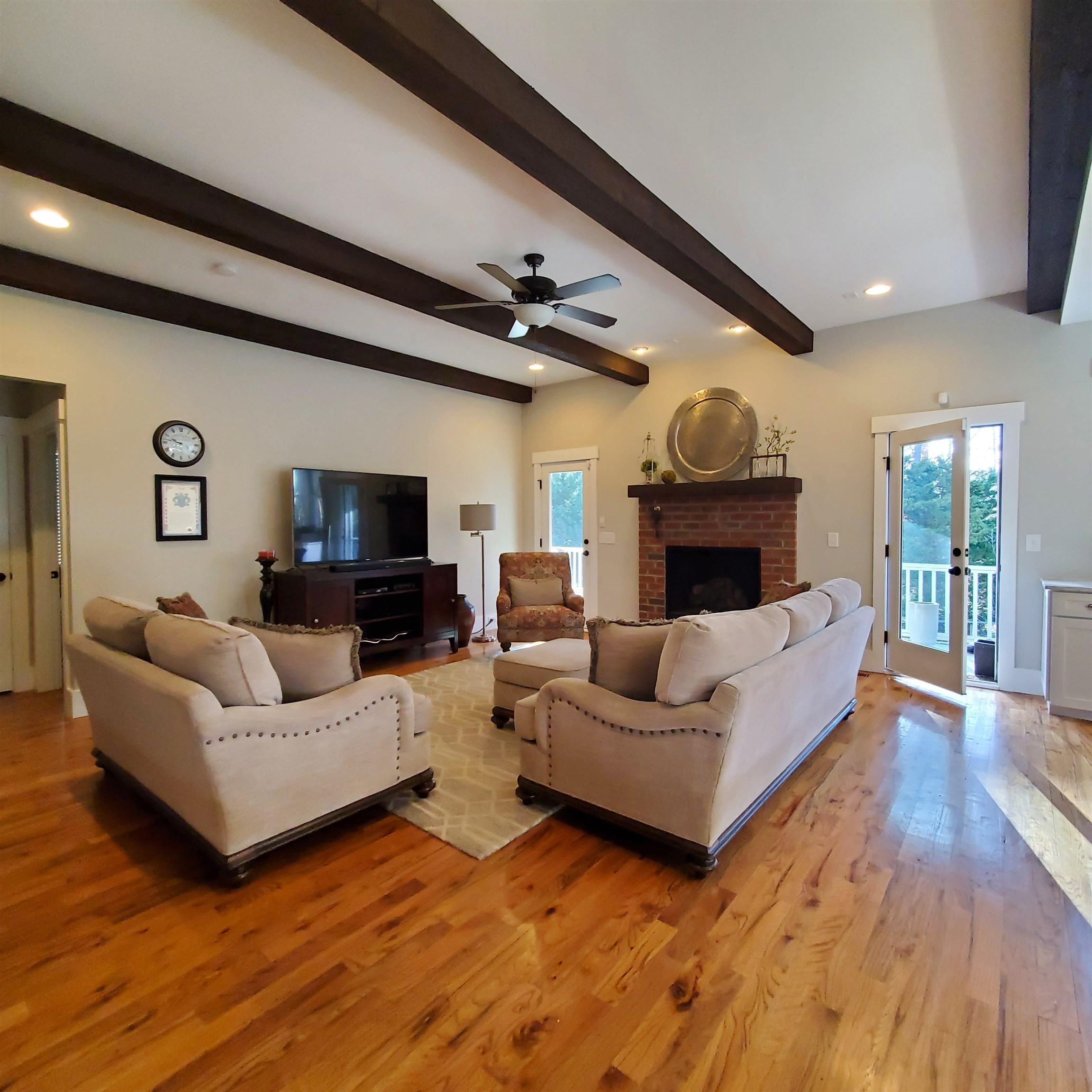 12628 Old Creedmoor Road Raleigh, NC 27613 - Photo 10 of 32 a living room with furniture and a fireplace