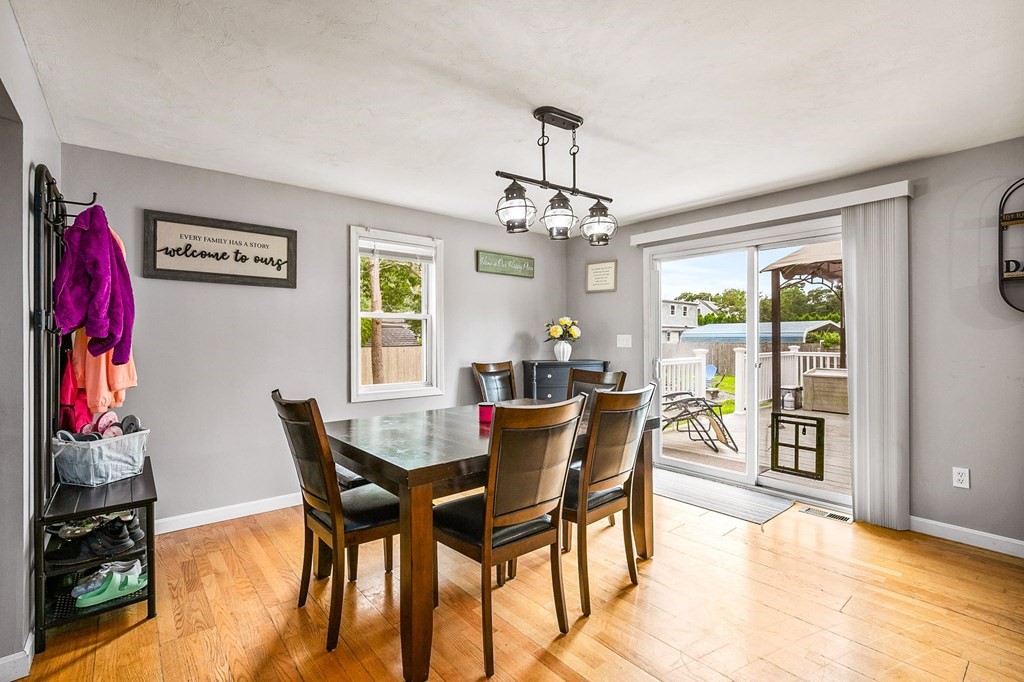 46 Cohasset Road Wareham, MA 02532 - Photo 15 of 42 a view of a dining room with furniture and a chandelier