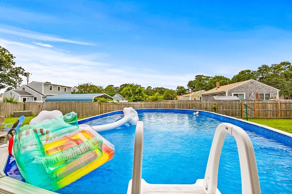 46 Cohasset Road Wareham, MA 02532 - Photo 10 of 42 a view of a swimming pool with an outdoor seating