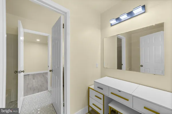 a room with a table and mirror
