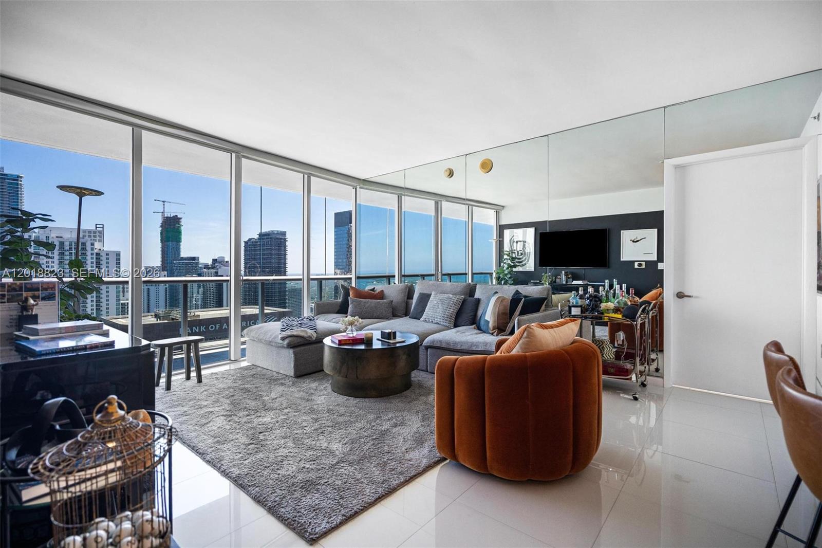 495 Brickell Avenue, Unit 4911 Miami, FL 33131 - Photo 6 of 35 a living room with furniture and a flat screen tv