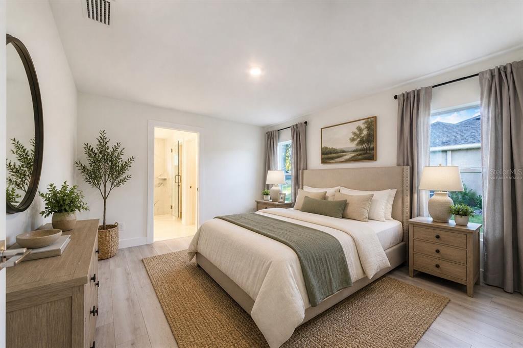 500 9th Street Northeast Fort Meade, FL 33841 - Photo 21 of 33 a bedroom with a large bed and a potted plant