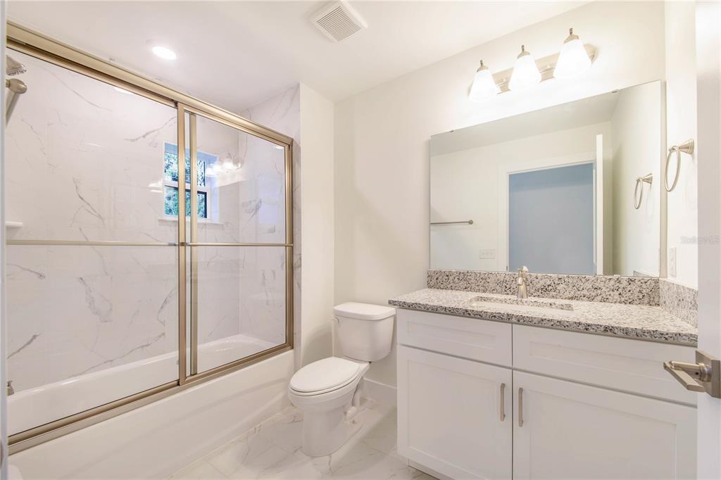 500 9th Street Northeast Fort Meade, FL 33841 - Photo 28 of 33 a bathroom with a granite countertop sink mirror vanity and toilet