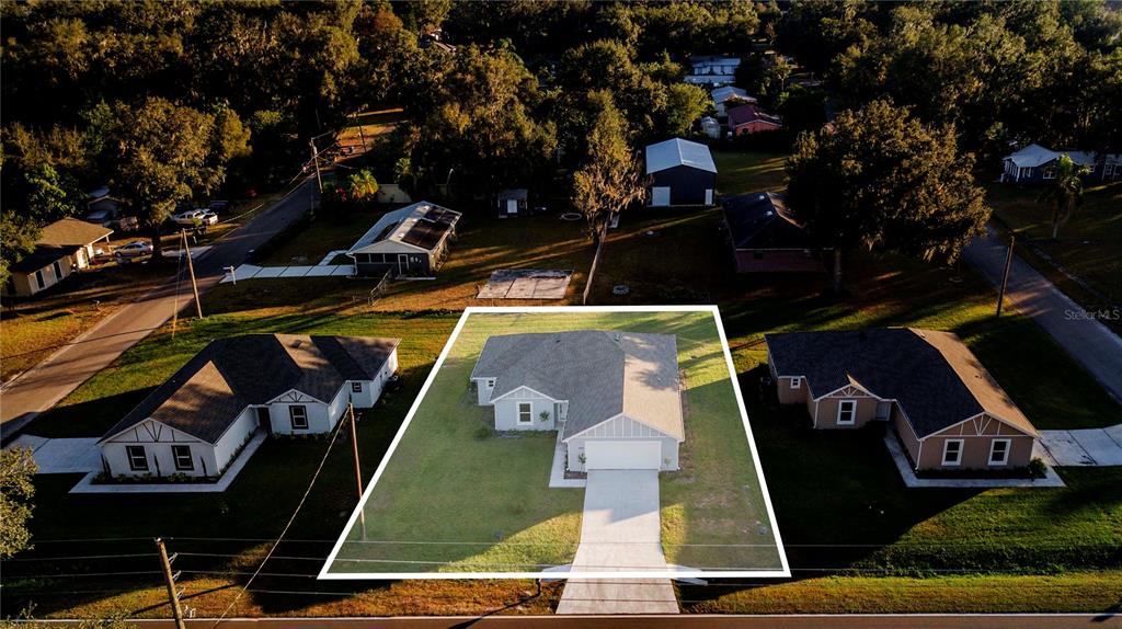 500 9th Street Northeast Fort Meade, FL 33841 - Photo 33 of 33 an aerial view of a house with a swimming pool
