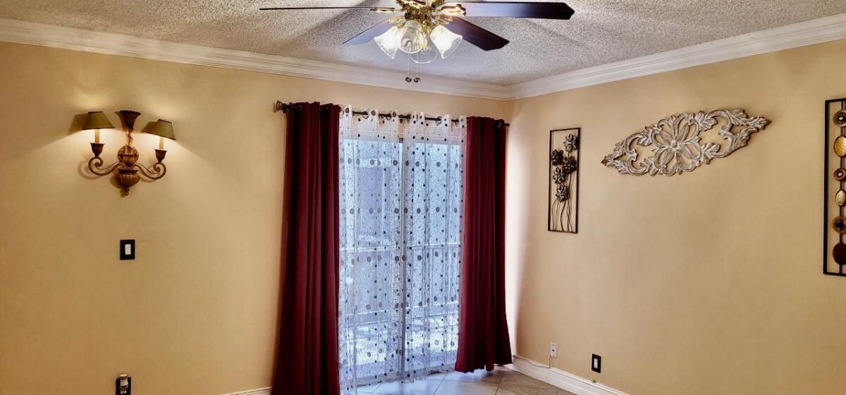 610 Northwest 13th Street, Unit 23 Boca Raton, FL 33486 - Photo 26 of 28 a bathroom with a shower and a ceiling fan