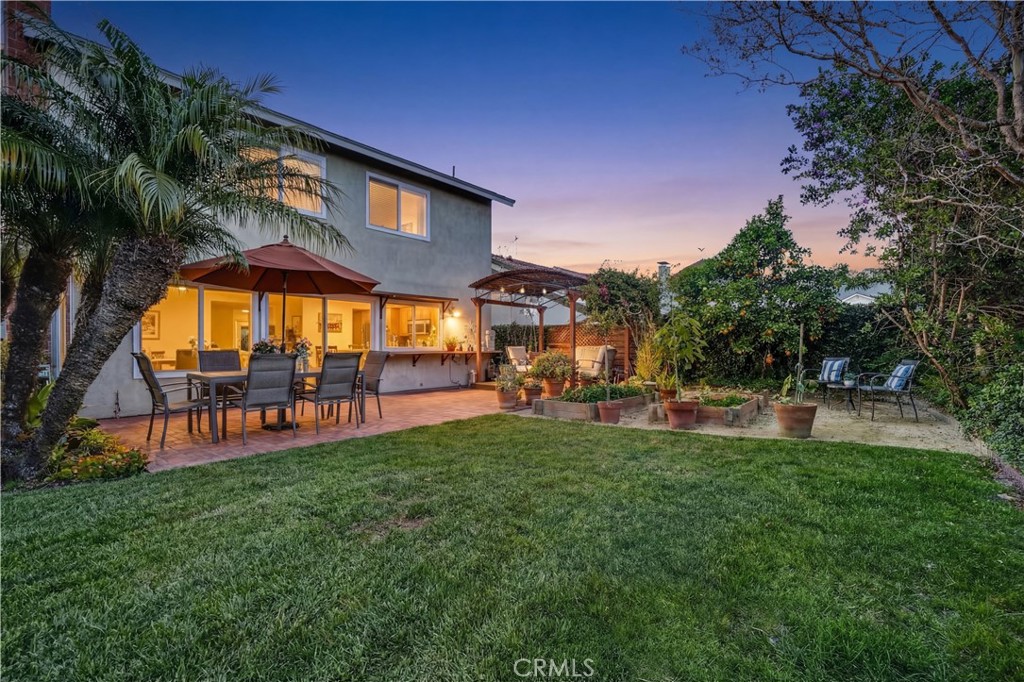 5552 Ridgebury Drive Huntington Beach, CA 92649 - Photo 1 of 31 a view of a house with swimming pool and sitting area