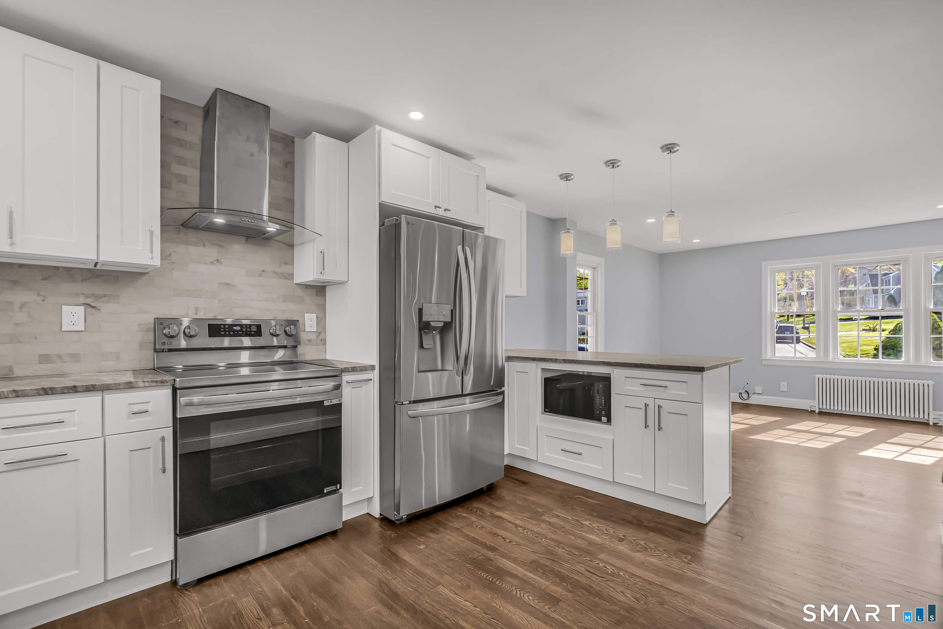 1770 Stratfield Road Fairfield, CT 06825 - Photo 15 of 40 a kitchen with stainless steel appliances a stove a sink and a refrigerator