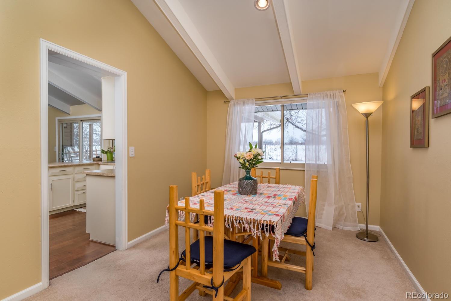4311 Carter Trail Boulder, CO 80301 - Photo 11 of 35 a dining room with furniture and window