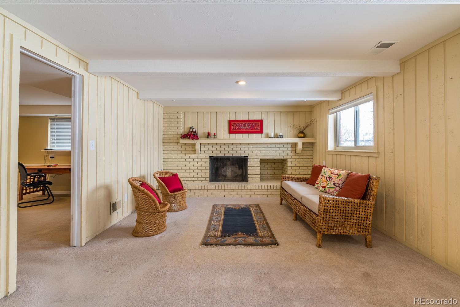 4311 Carter Trail Boulder, CO 80301 - Photo 17 of 35 a living room with furniture and a fireplace