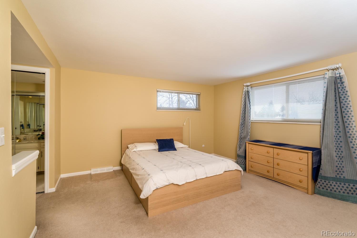 4311 Carter Trail Boulder, CO 80301 - Photo 20 of 35 a bedroom with a bed and a cabinets