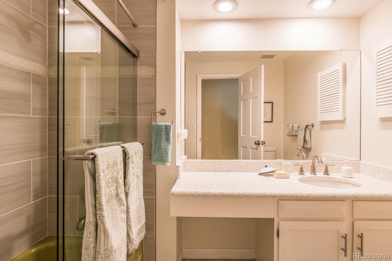 4311 Carter Trail Boulder, CO 80301 - Photo 24 of 35 a bathroom with a sink and a mirror