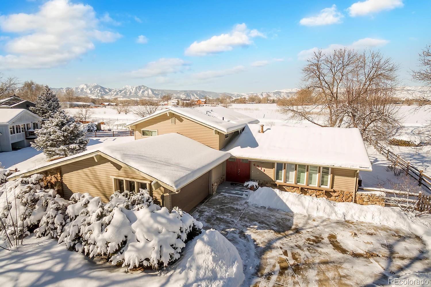 4311 Carter Trail Boulder, CO 80301 - Photo 5 of 35 a view of a white house with a snow on the road