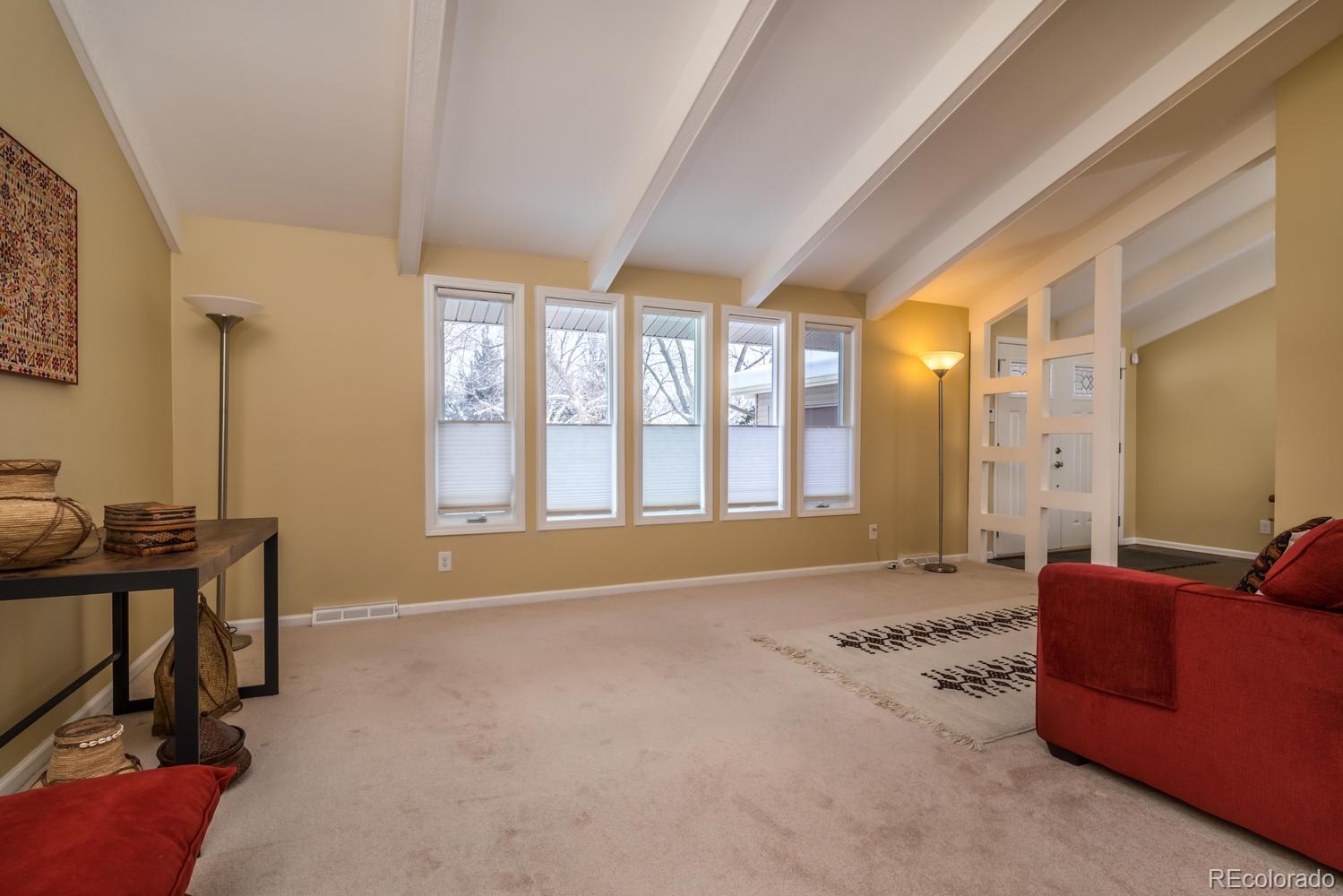 4311 Carter Trail Boulder, CO 80301 - Photo 9 of 35 a spacious bedroom with a bed and a couch