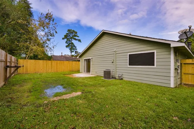 a backyard of a house with lots of green space
