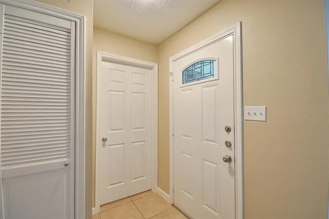 a view of a hallway with front door