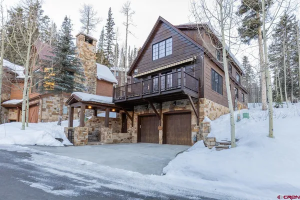 a view of a house with a snow