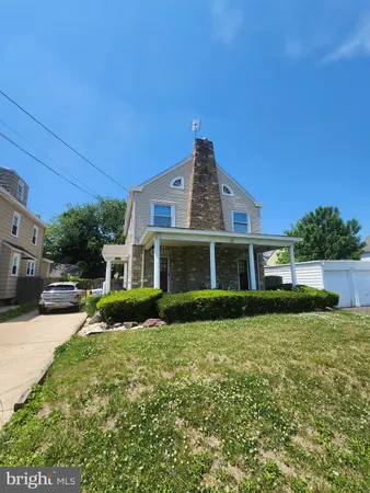 a front door view of a house with a yard