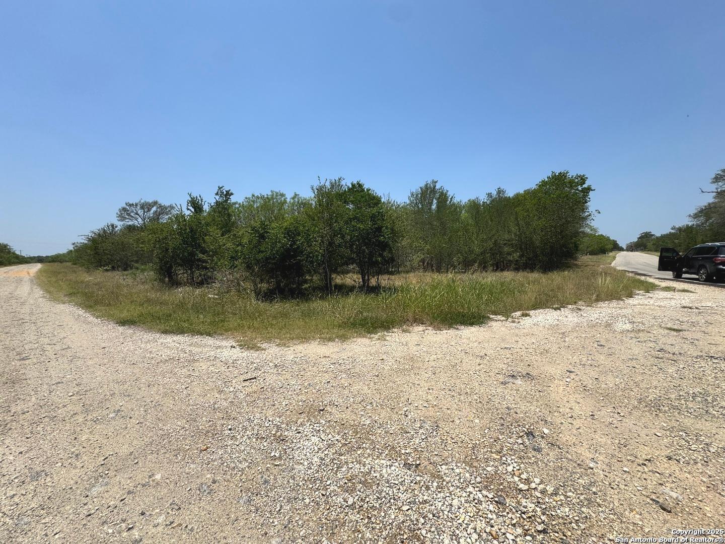 325 County Avenue Sutherland Springs, TX 78161 - Photo 5 of 6 a view of a lake with a mountain in the background