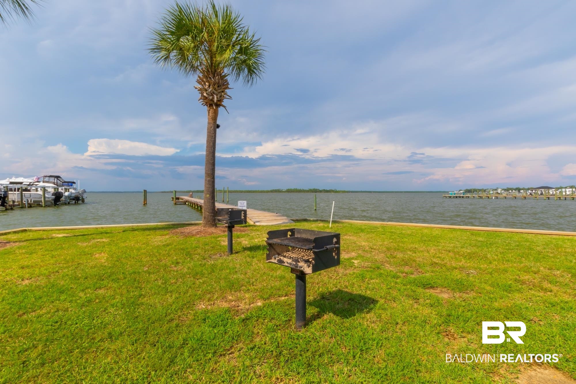 25925 -C Canal Road, Unit 203 Orange Beach, AL 36561 - Photo 50 of 57 View of property's community with a yard and a water view