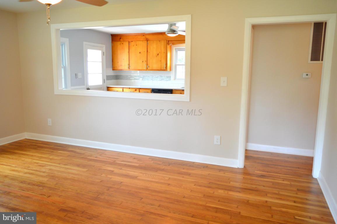 20306 Nanticoke Road Nanticoke, MD 21840 - Photo 11 of 24 a view of an empty room with wooden floor and a window