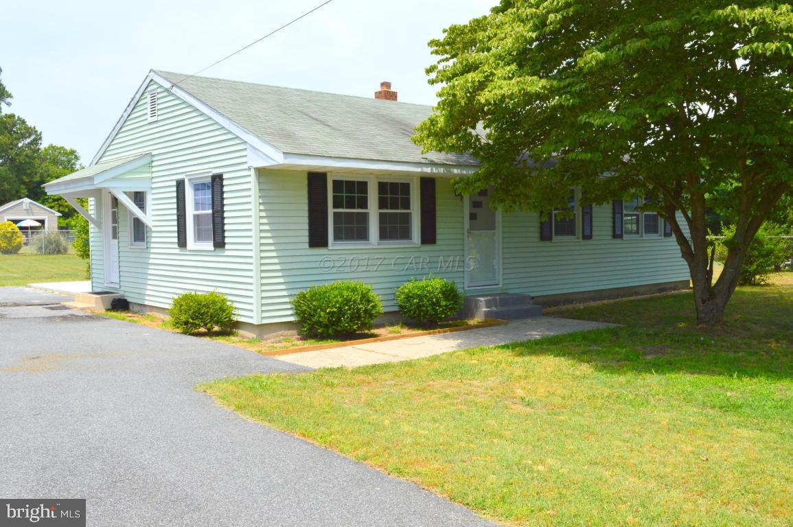 20306 Nanticoke Road Nanticoke, MD 21840 - Photo 24 of 24 a front view of a house with a yard and potted plants