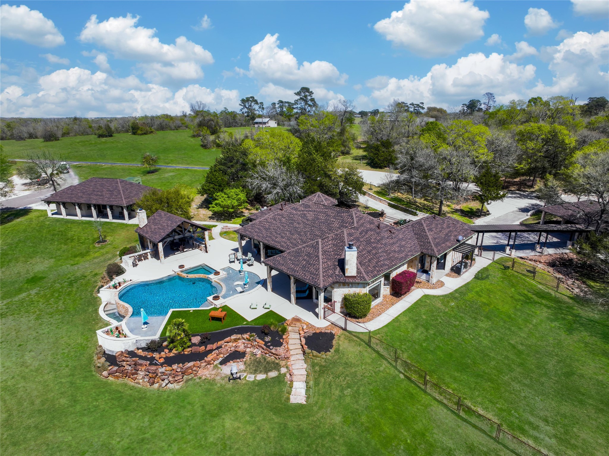 an aerial view of multiple houses with yard