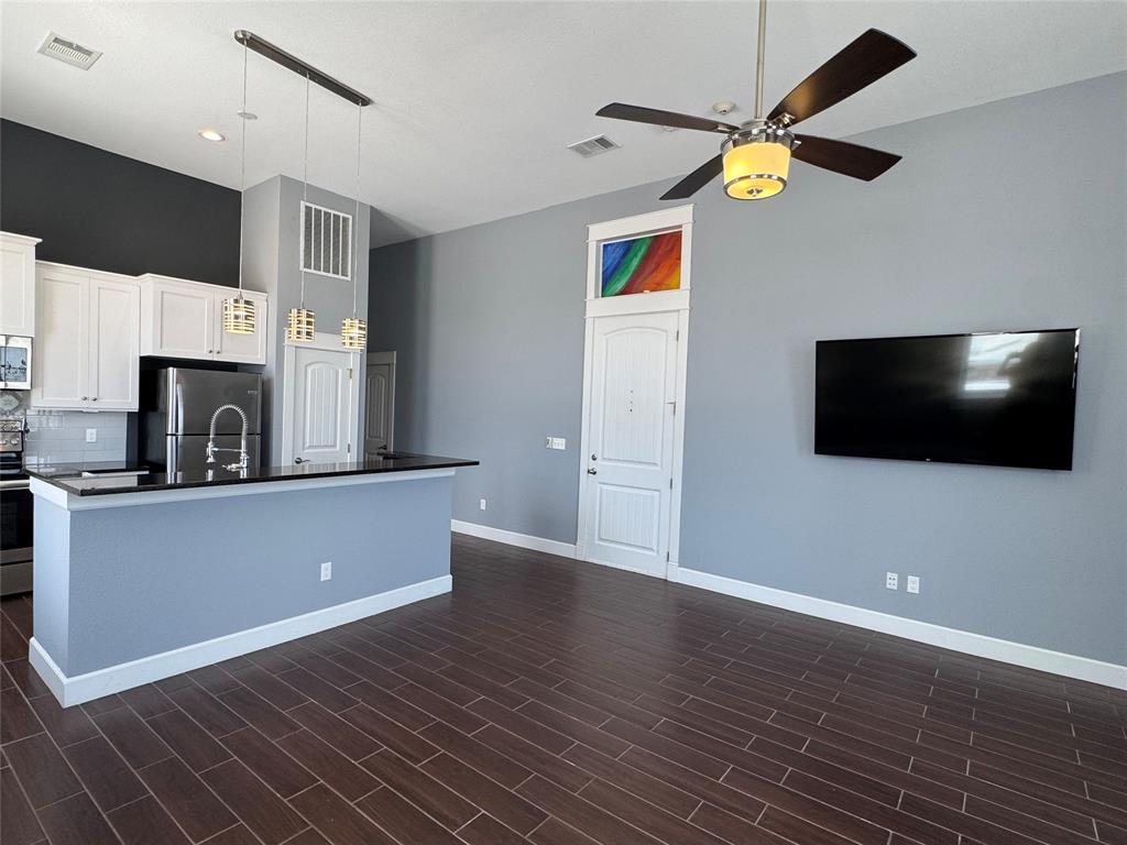 2901 Lee Street, Unit 2 Greenville, TX 75401 - Photo 4 of 14 a view of a livingroom with a flat screen tv