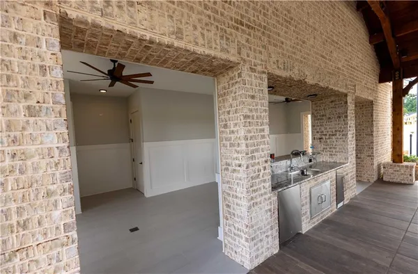 a view of an entryway with wooden floor