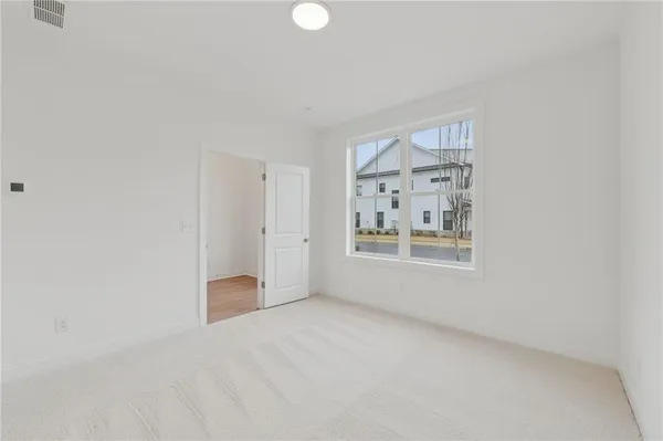 a view of a kitchen with a sink and wooden floor