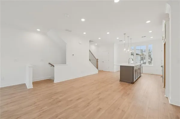 a large room with a lot of counter space and a sink