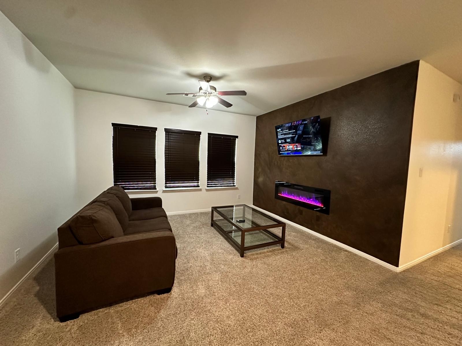 3322 Harvest Meadow Lane Rosenberg, TX 77471 - Photo 12 of 39 a living room with furniture and a flat screen tv