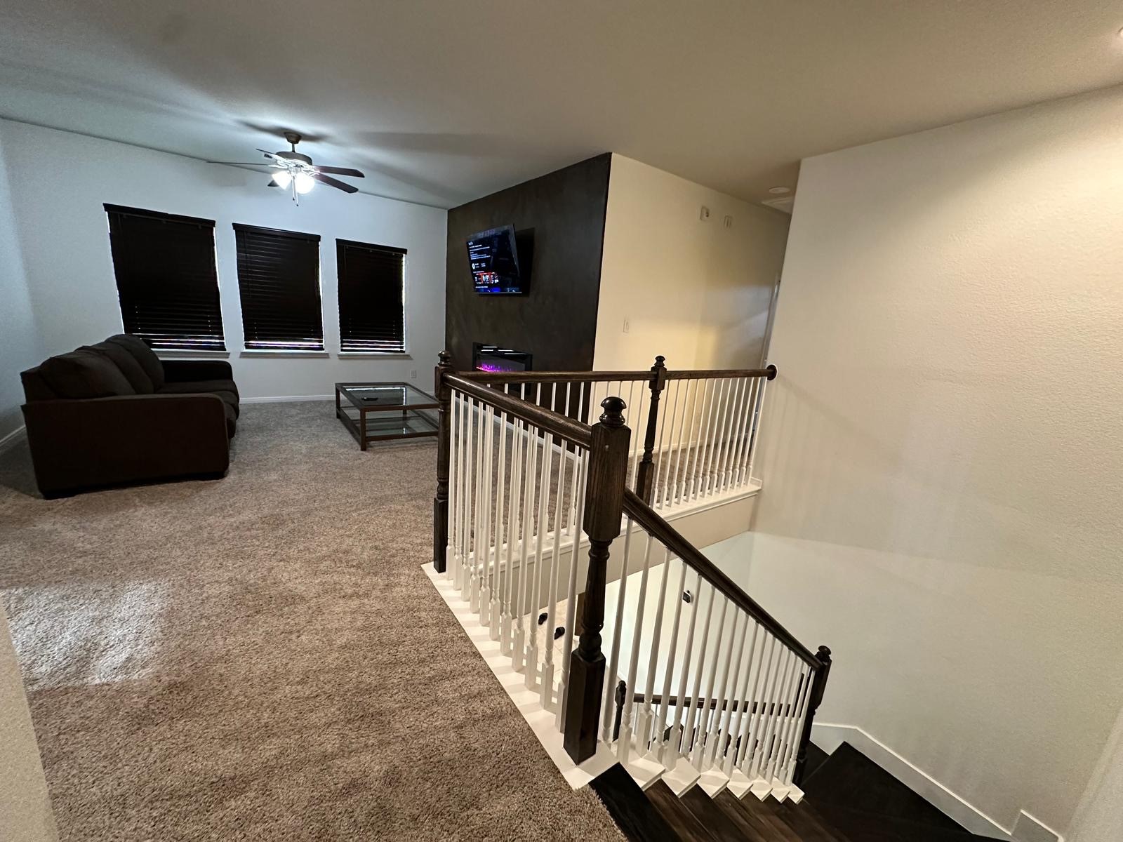 3322 Harvest Meadow Lane Rosenberg, TX 77471 - Photo 14 of 39 a view of a hallway with workspace and windows