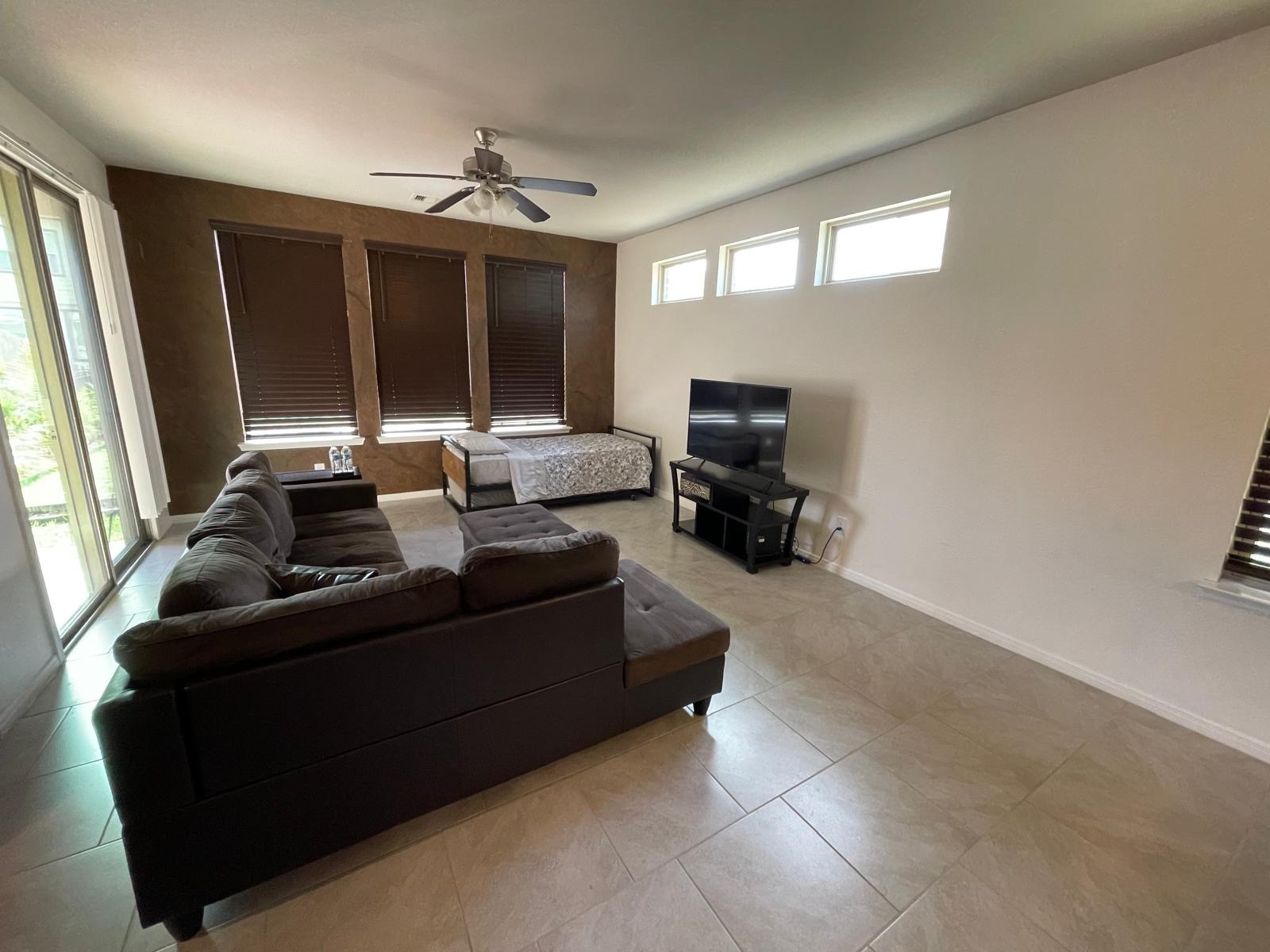 3322 Harvest Meadow Lane Rosenberg, TX 77471 - Photo 15 of 39 a living room with furniture and a flat screen tv